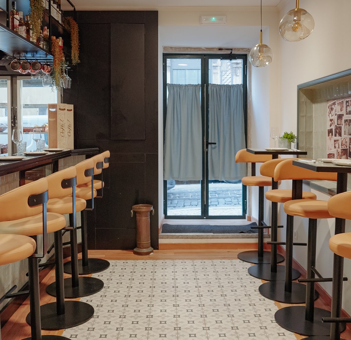 Entrance with high stools and encaustic tile floor