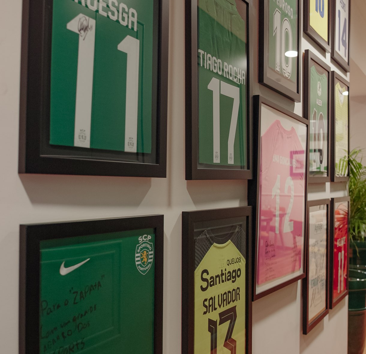 Framed football shirts on the wall